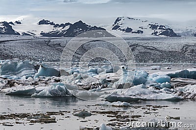 Melting tongue of the Breidamerkurjokull glacier summer season blue icebergs Stock Photo