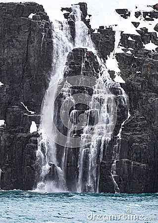 Melting water from glaciers and snow create stairstep waterfalls near Svalbard.CR2 Stock Photo