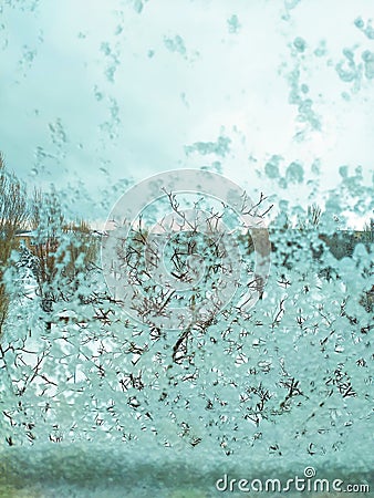 Melting and wet snow on the window. Background Screensaver Stock Photo