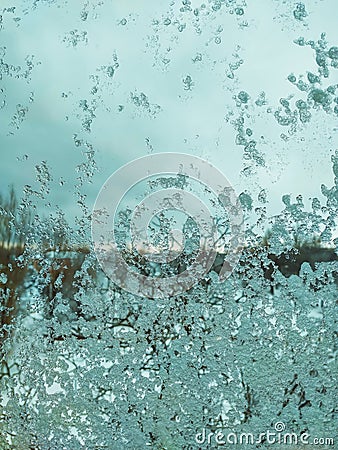 Melting and wet snow on the window. Background Screensaver Stock Photo