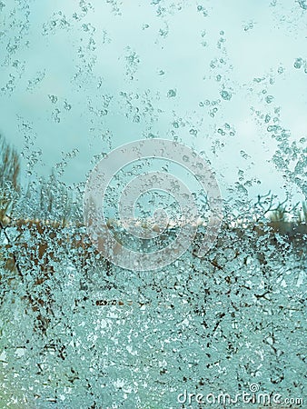 Melting and wet snow on the window. Background Screensaver Stock Photo