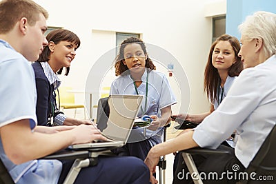 Members Of Medical Staff In Meeting Together Stock Photo