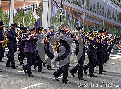 Members of the New York City Police Department band march in the 102nd Annual Veteran`s Day Parade along Fifth Avenue in NYC Editorial Stock Photo