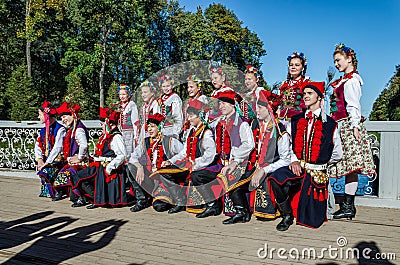 The members of the Polish folk dance GAIK making common photos for memory. Editorial Stock Photo