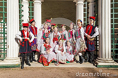 The members of the Polish folk dance GAIK making common photos for memory. Editorial Stock Photo