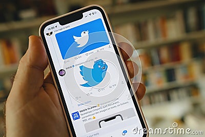 Memes about The X new Twitter app on a iPhone smartphone Editorial Stock Photo