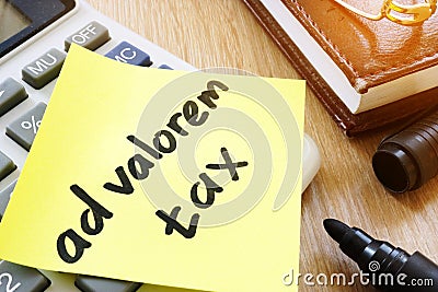 Memo stick with words ad valorem tax. Stock Photo