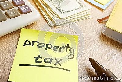 Memo stick with words property tax. Stock Photo