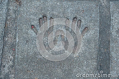 Memorable handprint of a hands in an old concrete wall Stock Photo