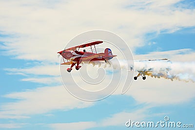 Memorial Airshow, Bucker Jungmeister in flight, smoke effect Editorial Stock Photo