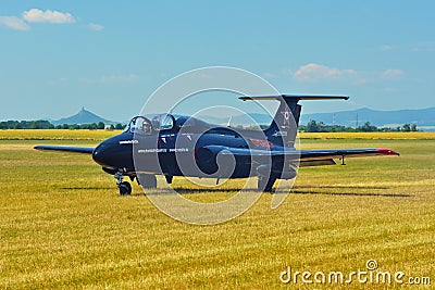 Memorial Airshow. Czech L29 advanced jet traning aircraft. Landing at a grassy airport. Editorial Stock Photo