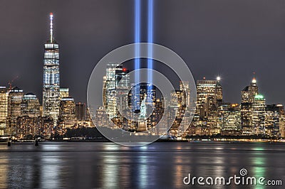 9/11 Memorial Beams with Statue of Liberty Between Them and Lower Manhattan Stock Photo