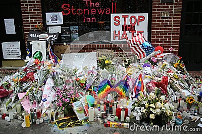 Memorial outside the gay rights landmark Stonewall Inn for the victims of the mass shooting in Pulse Club, Orlando Editorial Stock Photo