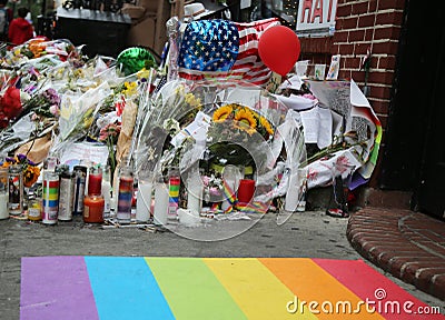 Memorial outside the gay rights landmark Stonewall Inn for the victims of the mass shooting in Pulse Club, Orlando Editorial Stock Photo