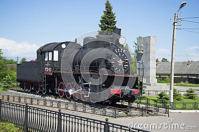 Memorial steam locomotive Em 721-83 mounted on the station Petrokrepost, Leningrad region Editorial Stock Photo