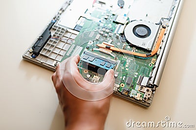 Memory module ddr4 ram installation in laptop by hand Stock Photo