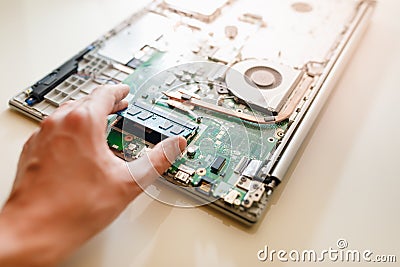 Memory module ddr4 ram installation in laptop by hand Stock Photo