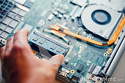 Memory module ddr4 ram installation in laptop by hand Stock Photo