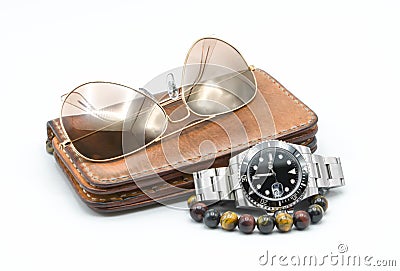 Men accessories, leather wallet, stainless watch, sunglass, bracelet on white background Stock Photo
