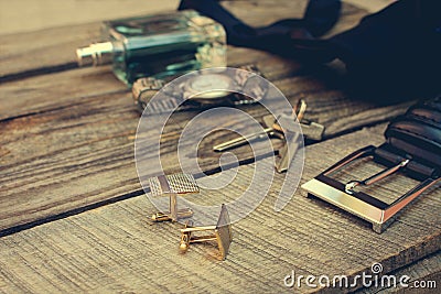 Men accessories: wrist watch, cufflinks, strap, keys, tie, perfume Stock Photo