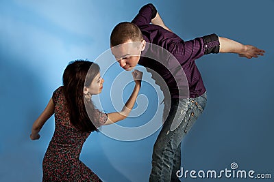 Men beaten up by women Stock Photo