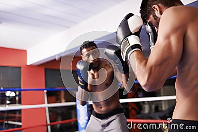 Men, boxing ring and gloves for fight competition in gym for challenge practice as opponents for workout, exercise or Stock Photo