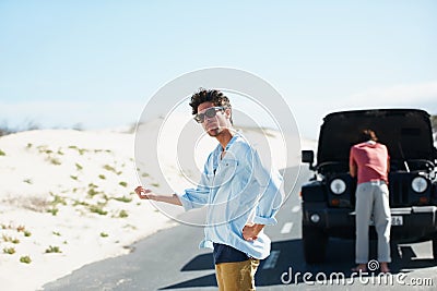 Men, car and hitchhiking in road for help or engine problem on roadtrip or journey outdoor in desert. People, travelers Stock Photo