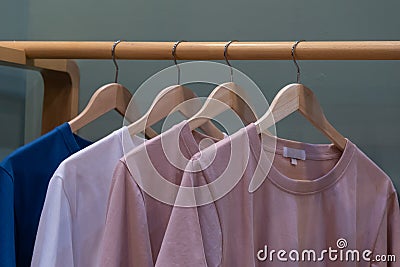 Men casual T shirt colorful hang in clothes rack Stock Photo