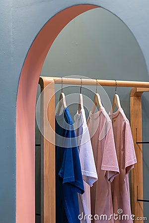 Men casual T shirt colorful hang in clothes rack Stock Photo