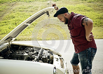 Men Checking Broke Down Car with Open Hood Stock Photo