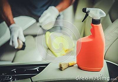 Men Cleaning Vehicle Interior Using Sanitizing Detergent Stock Photo