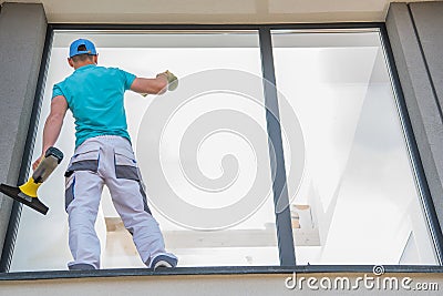 Men Cleaning Window Outside Stock Photo