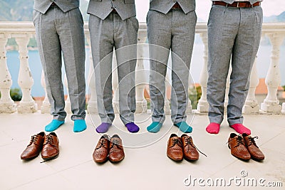 Men in colorful socks. Funny wedding photos. Wedding in Monteneg Stock Photo