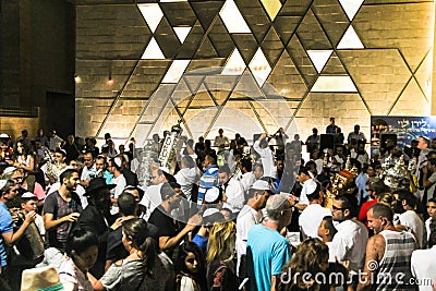 Men dance with Bible scrolls during the ceremony of Simhath Torah. Tel Aviv. Israel Editorial Stock Photo
