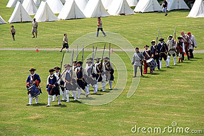 Men dressed in soldier`s uniforms, re-enacting the war, Fort Ontario, New York, 2016 Editorial Stock Photo