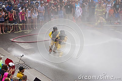 Men dressed in yellow firemen slickers Editorial Stock Photo