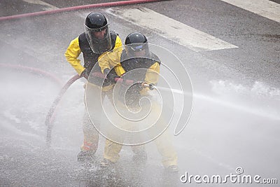 Men dressed in yellow firemen slickers Editorial Stock Photo