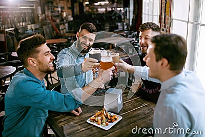 Men Drinking Beer In Pub Stock Photo
