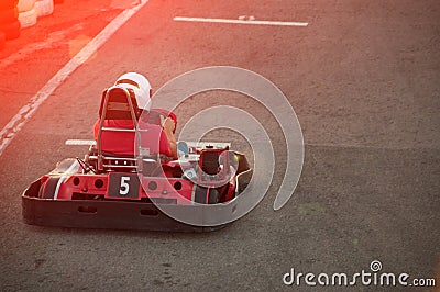 Men driving Go-kart car with speed in a playground racing track. Stock Photo