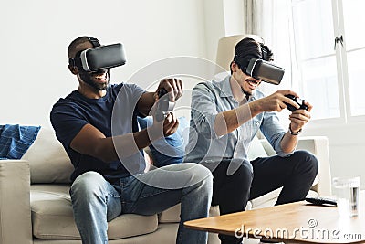 Men experiencing virtual reality with VR headset Stock Photo