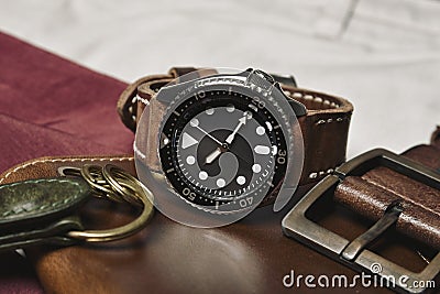 Men fashion and accessories, Wrist watch with brown leather strap, Stylish men stuff, Diving watch Stock Photo