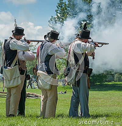 Men Firing Guns Together Editorial Stock Photo