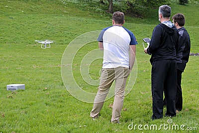 Men flying a drone in the park Editorial Stock Photo