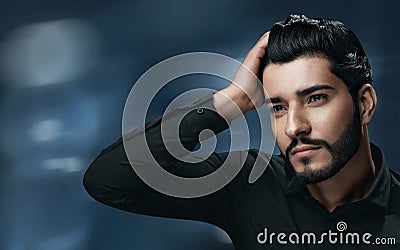 Men Hair Care. Handsome Man With Beard Touching Healthy Hair Stock Photo