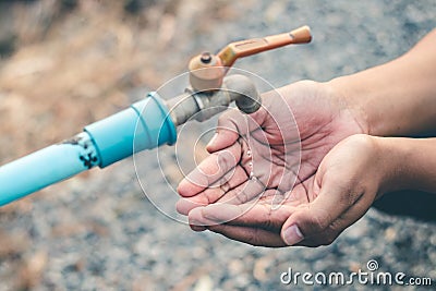 Men hand are waiting to drink water in the water shortage Stock Photo