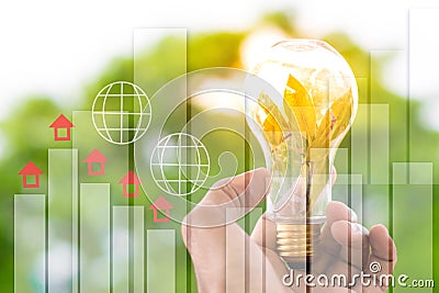 Men hold light bulbs with sun in the daytime, with bokeh backdrops and Statistic graph using wallpaper or background for idea work Stock Photo