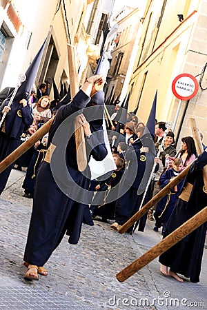 Men holding crucifix, Easter procession in Jerez Editorial Stock Photo