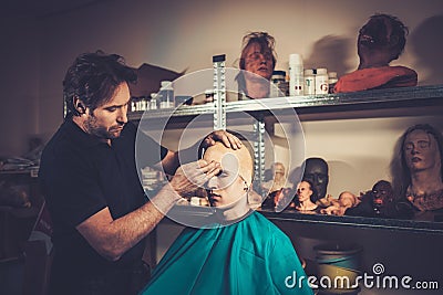 Men during lifecasting process Stock Photo