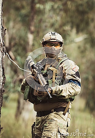 Men in military uniform with weapon Stock Photo