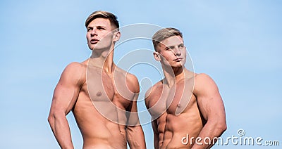 Men muscular chest naked torso stand sky background. Strong muscles emphasize masculinity sexuality. Bodybuilder shape Stock Photo